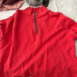 Red zip-up sweatshirt with zipper sleeves